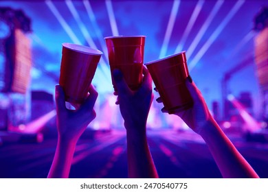 Cheers. Friends gathering at night to have fun. attending nightclub, dancing, drinking beer and enjoying. Concept of party, celebration, leisure activity, fun, night life - Powered by Shutterstock