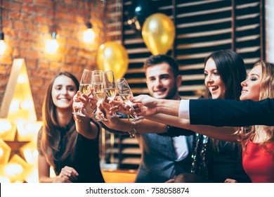 Cheers! Friends With Glasses Of Champagne During Party Celebration. New Year, Birthday, Holiday Event Concept