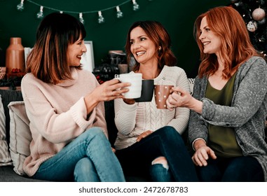 Cheers, friends and women on couch with smile for celebration, holidays and reunion in home. Coffee, happiness and together in living room for vacation, connection and toast with tea in apartment - Powered by Shutterstock