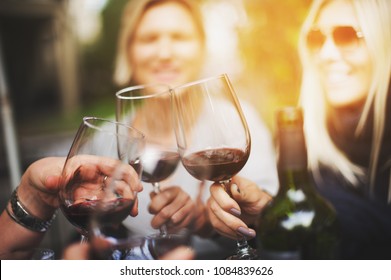 Cheers With Glasses Of Red Wine, Friends In The Restaurant