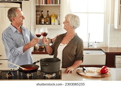 Cheers, happy or old couple cooking food for a healthy vegan diet together with love in retirement at home. Smile, toast or senior woman drinking wine in kitchen to celebrate with husband at dinner - Powered by Shutterstock