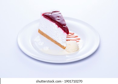 Chees Cake On A White Plate With A White Background