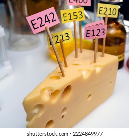 Cheese Adorned With Additive Labels E. Food Laboratory On A Lab Bench