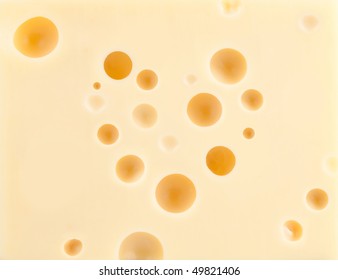 Cheese Background With Heart Shape Holes