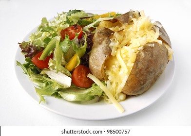 Cheese Baked Potato On A Plate With Side Salad