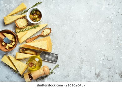 Cheese Banner. Set Of Pieces Of Hard Cheese. Top View. On A Gray Stone Background.