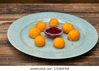 Cheese Bites With Dipping Sauce On Wooden Background