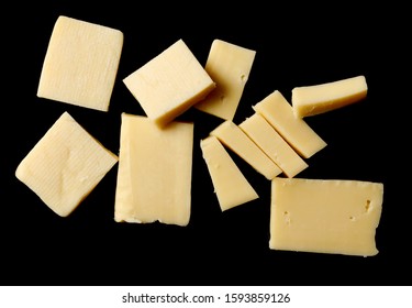 Cheese Block Slices Isolated On Black Background, Top View