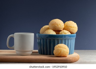 Cheese Bread (Pão De Queijo) On A Blue Bowl And A Cup Of Coffee