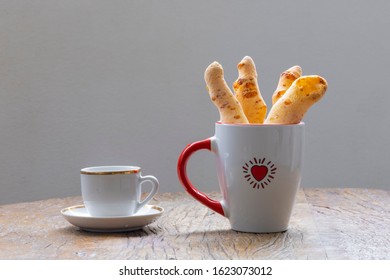 cheese bread on sticks in a cup