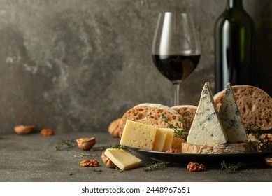 Cheese, bread, red wine, and walnuts on a kitchen table. Traditional Mediterranean snacks. - Powered by Shutterstock