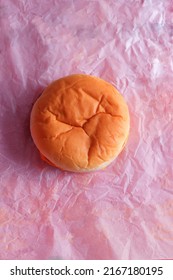 Cheese Burger From A Fast Food Restaurant Shot From Above On It’s Paper Wrapper