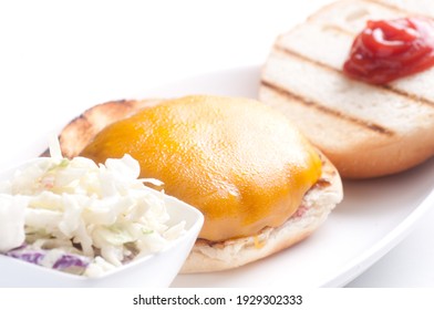 Cheese Burger On A Toasted Bun With Cole Slaw