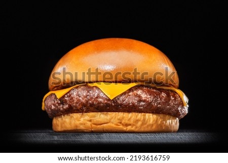 cheese burguer smashburger in black background