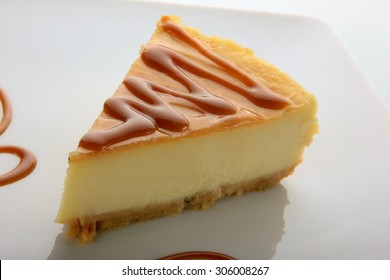 Cheese Cake With Caramel Sauce Isolated