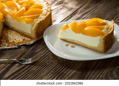 cheese cake with peach on a dark background, curd cake
