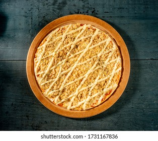 cheese ( catupiry ) and chicken pizza on indigo blue wooden table, top view - Powered by Shutterstock