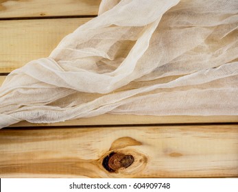 Cheese Cloth On Top Of Wooden Planks