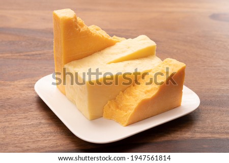 Cheese collection, cheeses from United Kingdom, scottish matured farmcheese and mild cheddar cheese close up