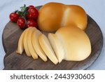 Cheese collection, Italian cheese scamorza, caciocavallo, provolone made from cow milk in South Italy yellow smoked cheese close up