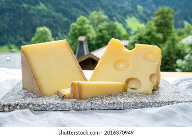 Cheese Collection, Swiss Cow Cheese Emmental And Gruyere And Mountains Village In Apls In Summer 2on Background