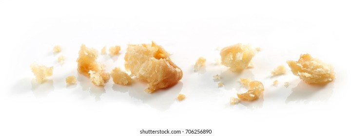 Cheese cookie crumbs macro isolated on white background