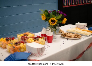 Cheese, Crackers, And Fruit At A Party