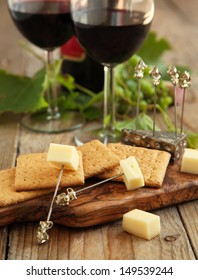 Cheese And Crackers With Glasses Of Red Wine