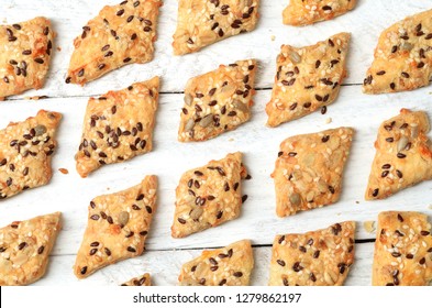 Cheese Crackers As A Pattern On Wooden Background