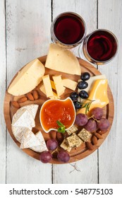 Cheese Cutting, Grapes And Wine On A Table, Selective Focus, Copy Space, Top View