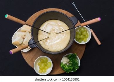 A cheese fondue on a table top