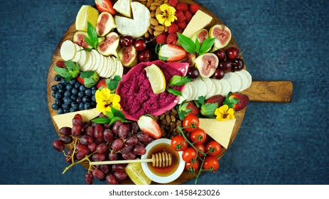 Cheese And Fruit Charcuterie Dessert Grazing Platter On Wooden Board Overhead.