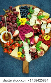 Cheese And Fruit Charcuterie Dessert Grazing Platter On Wooden Board Overhead.