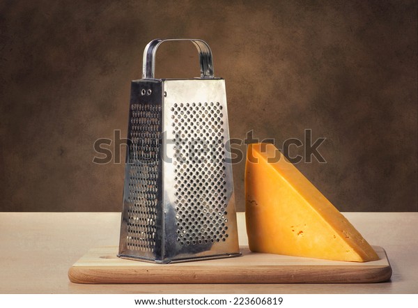 Cheese grater on a brown\
background