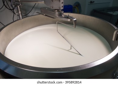 Cheese maker -Traditional cheese making at a creamery, - Shutterstock ID 395892814