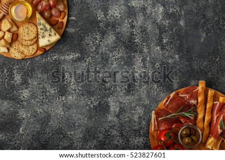 Cheese and meat appetizer selection.Top view with copy space.
