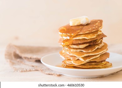 cheese on pancake stack with honey