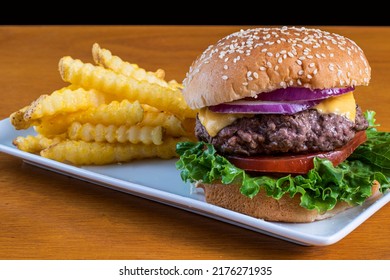 cheese  on sesame bun  served with a side fries - Powered by Shutterstock