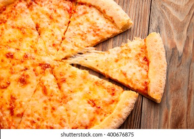 Cheese Pizza On A Wooden Table