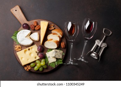 Cheese Plate With Grapes And Nuts. Wine Snaks. Top View With Space For Your Text