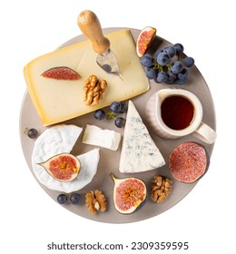 Cheese plate isolated on white background. Different cheese served with nuts, fruits and honey. Cheese platter. Top view. - Powered by Shutterstock