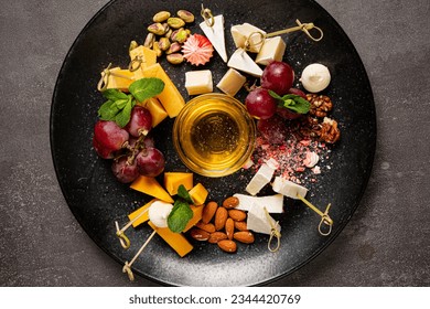 cheese plate on the dark background - Powered by Shutterstock