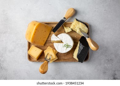 Cheese Plate On Gray Table. Cheese Platter On Wooden Board. Top View.