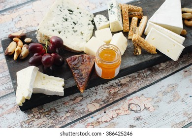 Cheese Plate On Wooden Background