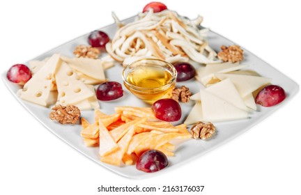 Cheese Plate With Parmesan Chechil And Walnut With Honey On A White Background