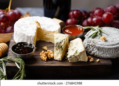Cheese plate   served with wine, jam and honey close-up - Shutterstock ID 276841988