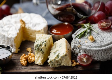 Cheese Plate Served With Wine, Jam And Honey Close-up