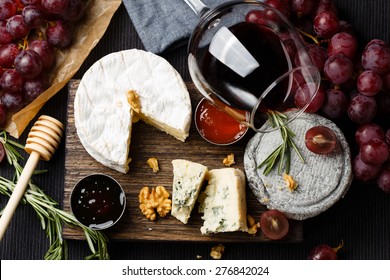 Cheese plate served with wine, jam and honey top view - Shutterstock ID 276842024