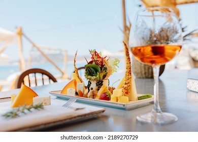 Cheese Plate And White Wine On The Terrace.