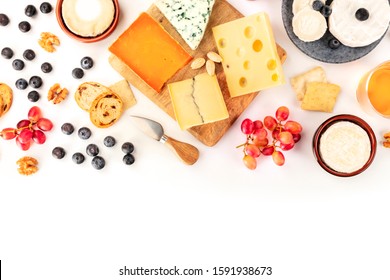 Cheese Platter Background With A Place For Text, A Flat Lay Overhead Shot On White. Blue Cheese, Goat Cheese, Brie And Other Sorts With Fruits, Nuts And Almonds, A Design Template